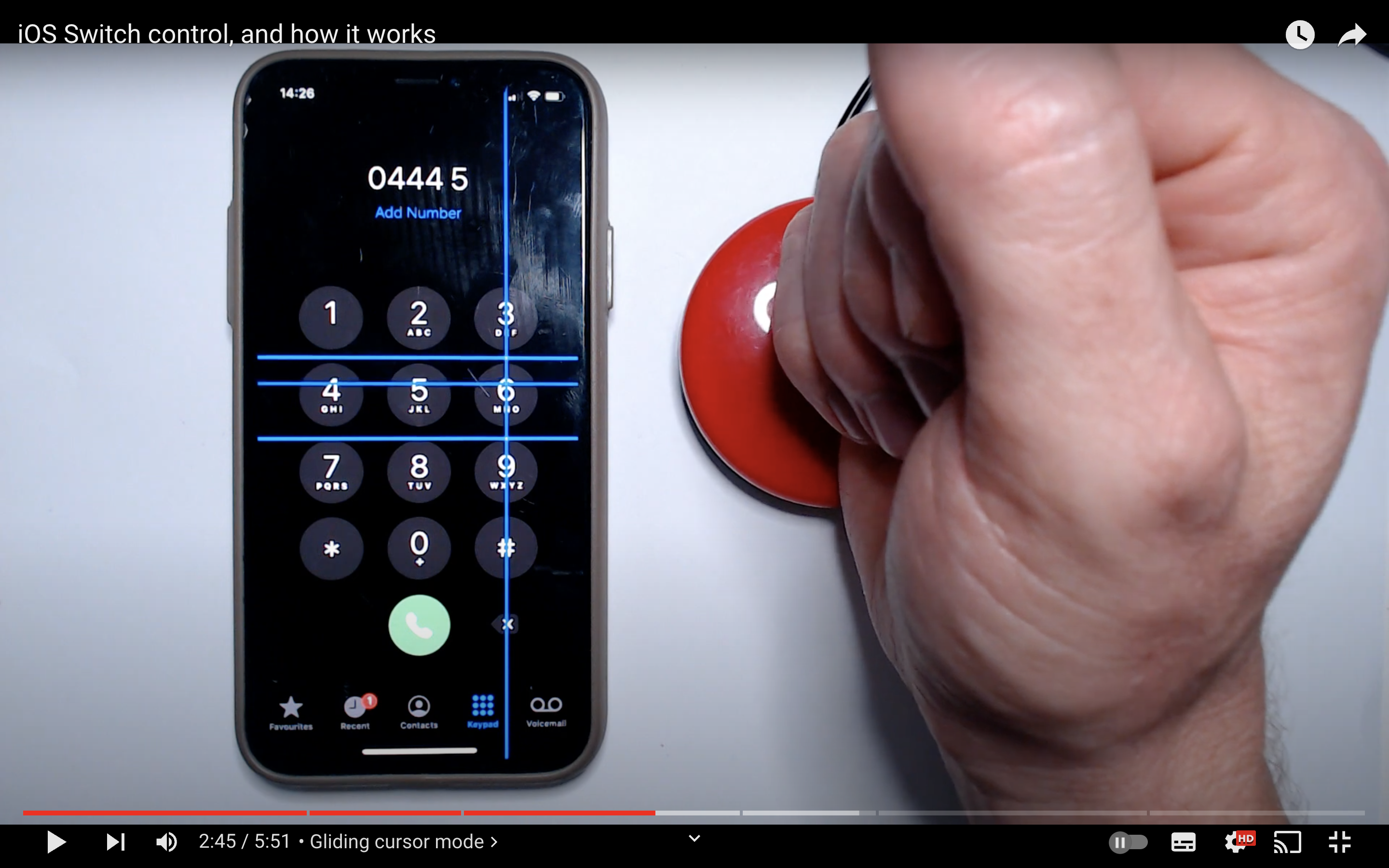 A screenshot of YouTube video showcasing switch control mode on iOS.